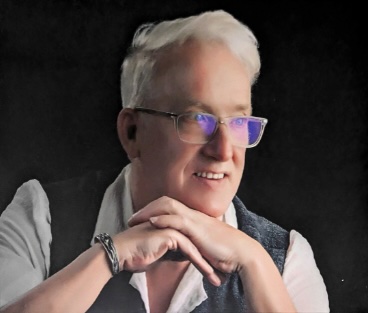 Don Engerdahl holding a framed watercolour painting