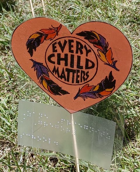 Community members wearing Every Child Matters shirts