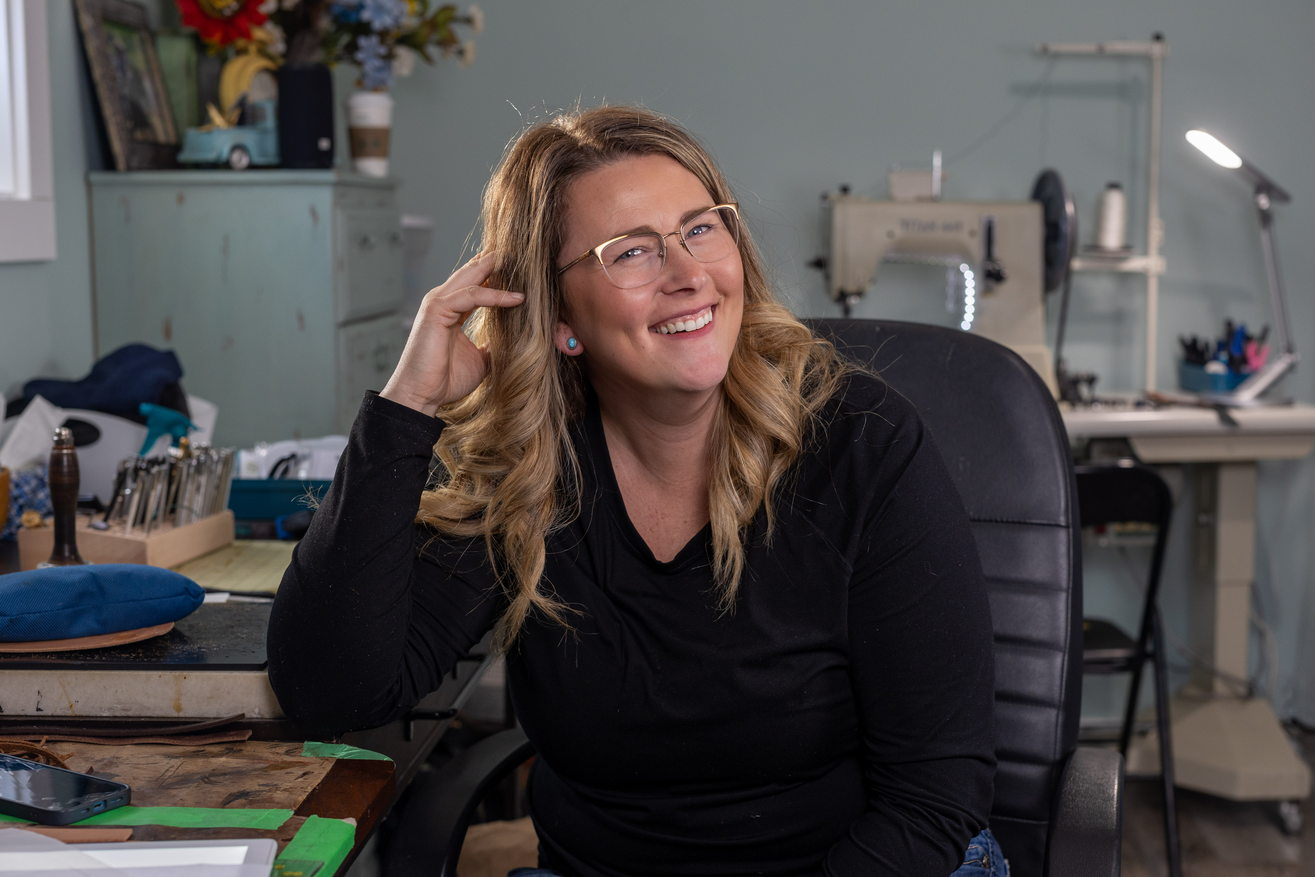 Kailee Groat showcasing HazeLee Leather work